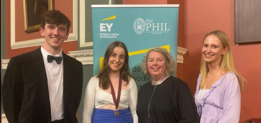 Students from the Phil - Tom Comer, Ellen McKimm, Anna Clarke posing with Linda Doyle.