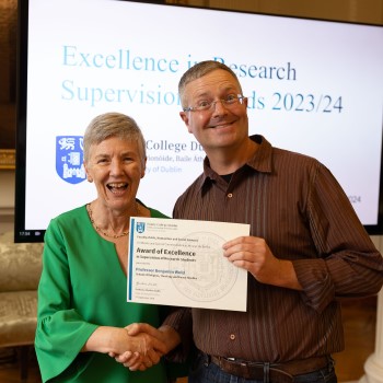 Ben Wold receiving his excellence in research supervision award 23-24