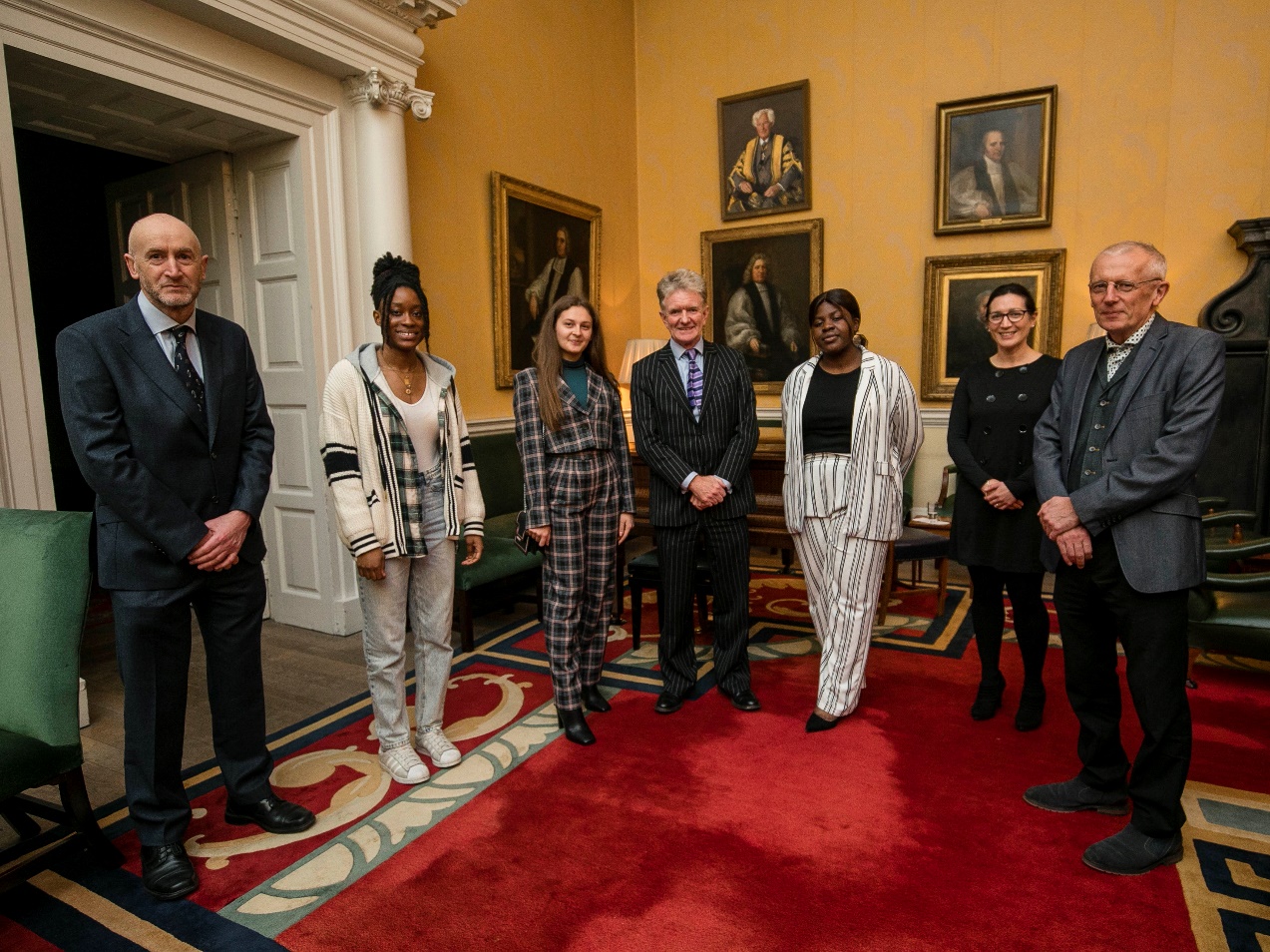 The three scholarship awardees standing beside three academics from the School of Computer Science and Statistics and the Head of School