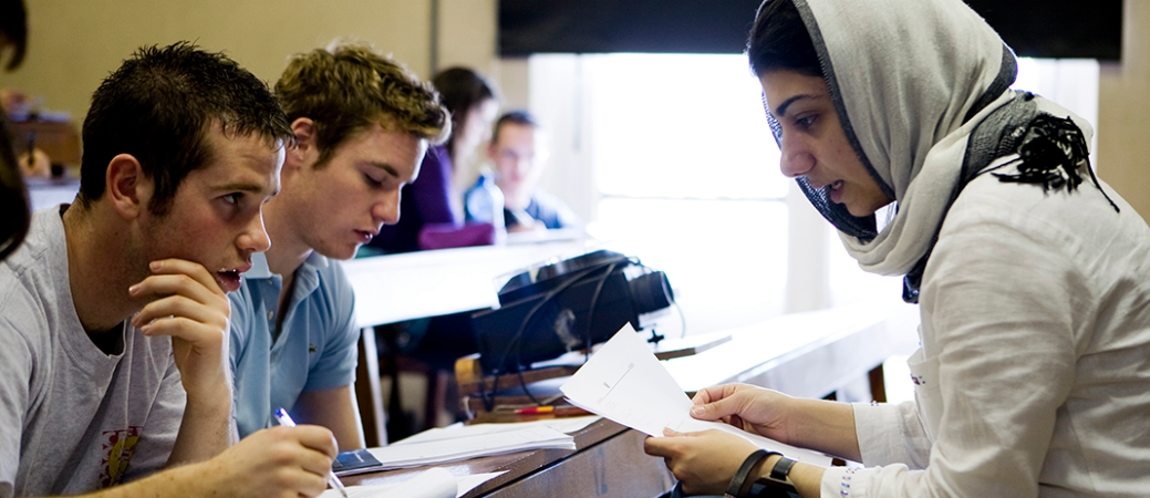 3 students laughing and chatting