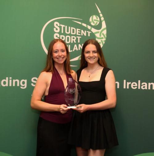 Ciara Mulligan and Hannah Murphy from Trinity Women's Basketball accept their SSI Team of the Year Award 2024-5