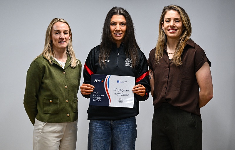 Keri McCormick of Trinity College Dublin, centre, is presented with her certificate by Trinity College Dublin Student Sport Pathway Manager Lisa Cafferky, left, and GPA national executive committee co-chair and Dublin camogie player Aisling Maher during the GPA Enhanced Scholarship Awards 2026