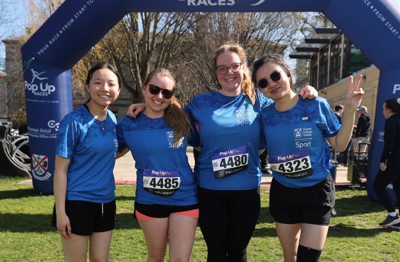 Four women at the finish of the 2025 Campus 5K