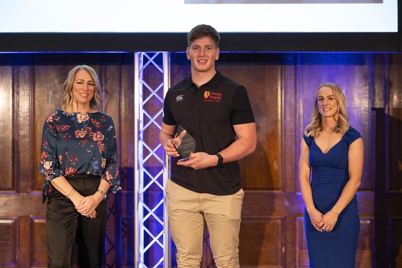 Joe McCarthy being awarded a Trinity Sport Scholarship with Michelle Tanner and Lisa Cafferky from Trinity Sport