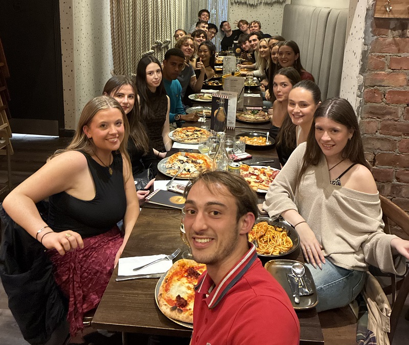 Trinity basketball at Edinburgh Invitational September 2025 informal group photo at dinner