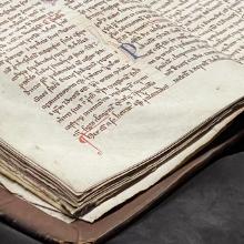 Corner of a medieval manuscript on a book cradle