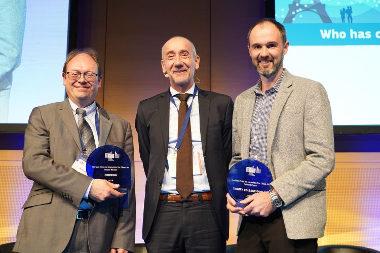 Assistant Professor John Gallagher (right) with the ‘Materials for Clean Air’ Prize winner Dr Jean-Jacques Theron from Corning SAS France (left) after being presented with their awards from Jean-Eric Paquet (centre), Director-General for Research & Innovation in the European Commission (©Roman Zach-Kiesling).