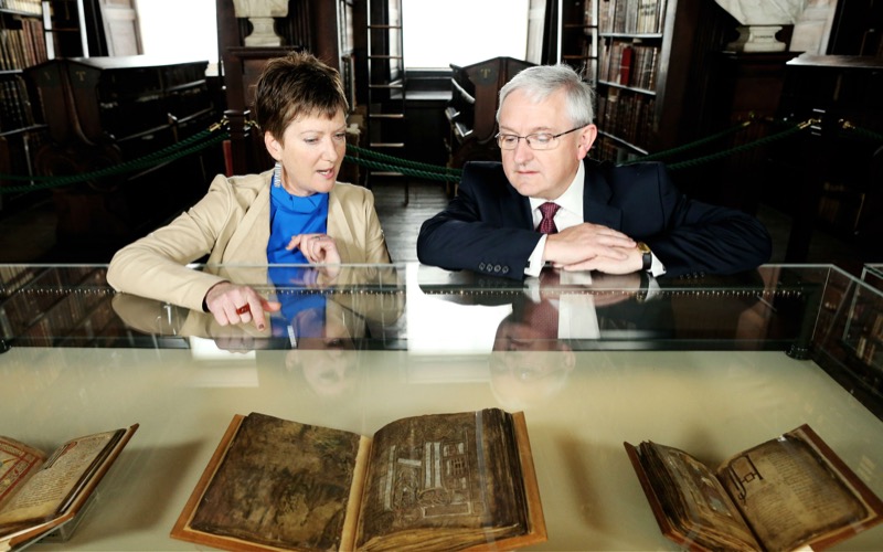 Susie Bioletti, Head of Conservation shows Peter Keegan, Country Executive for Ireland at Bank of America Merrill Lynch the manuscripts.
