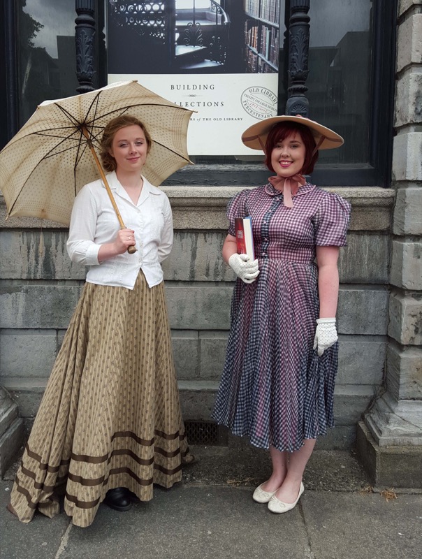 Pictured are two Welcome Ambassadors students, 3rd year Drama and Theatre student, Honoria Cooke, in Edwardian dress telling the story of the first women who were permitted to study at Trinity in 1904 and 2nd year English Literature and Drama student, Christina Hamilton, highlighting the 1950s era.