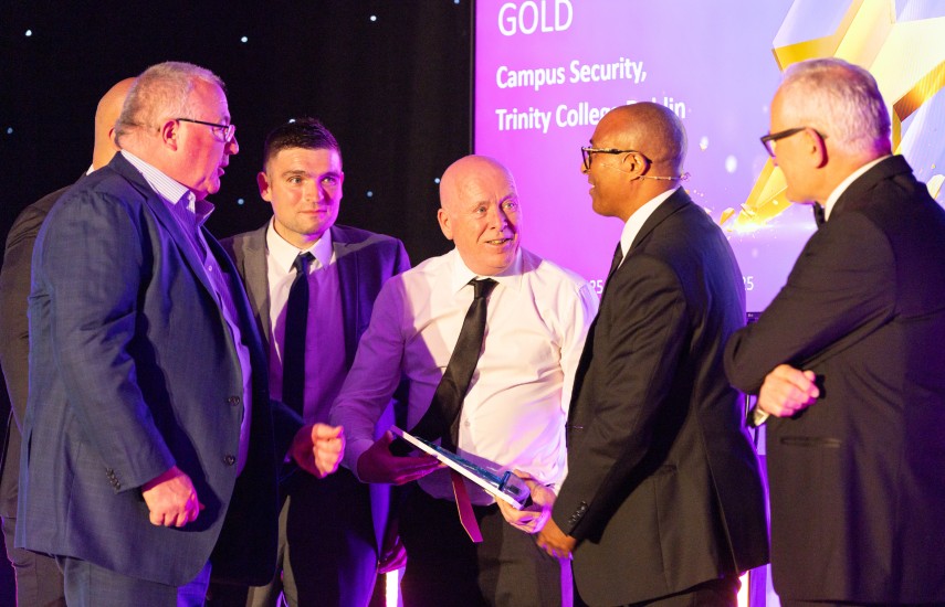A team of men receving an award