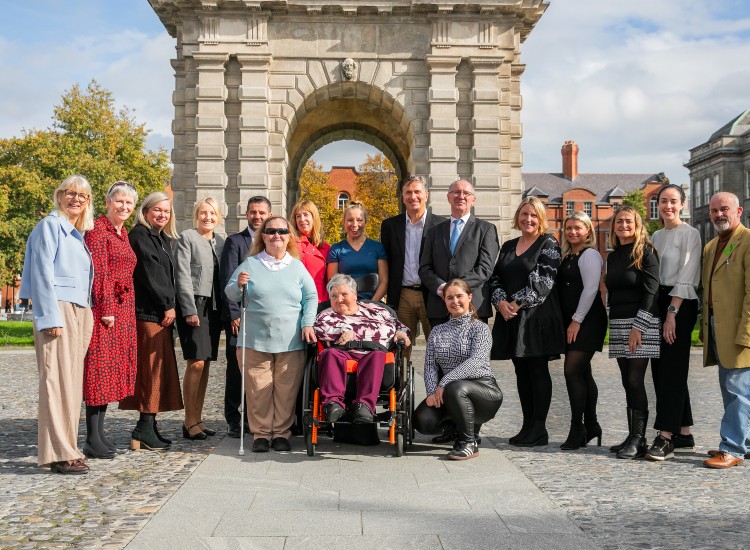 Large group of people pose outdoors