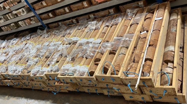 Sampling of the Carnduff cores (here studied), which were drilled in the Larne Basin, Northern Ireland. The cores are stacked neatly in wooden boxes.
