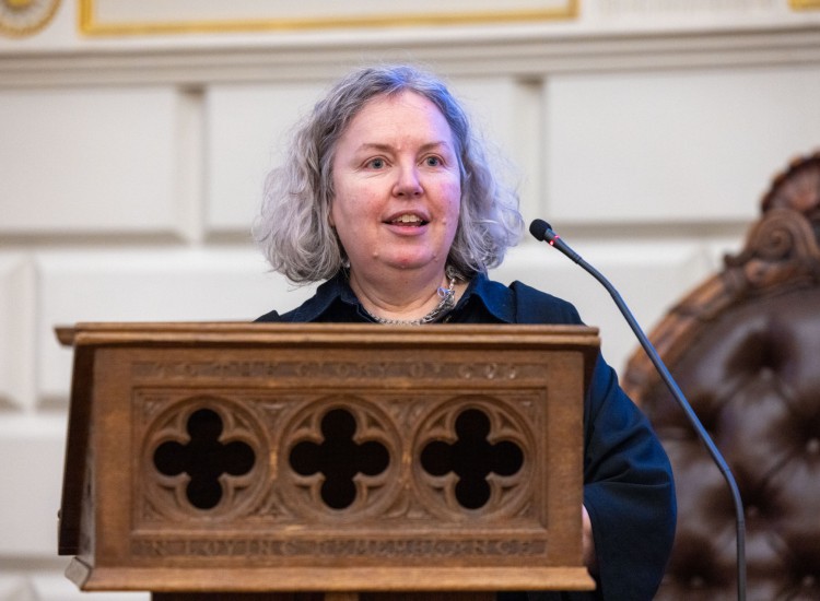 Woman speaks from a podium