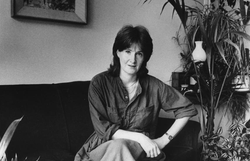 Woan pictured in black and white on a sofa