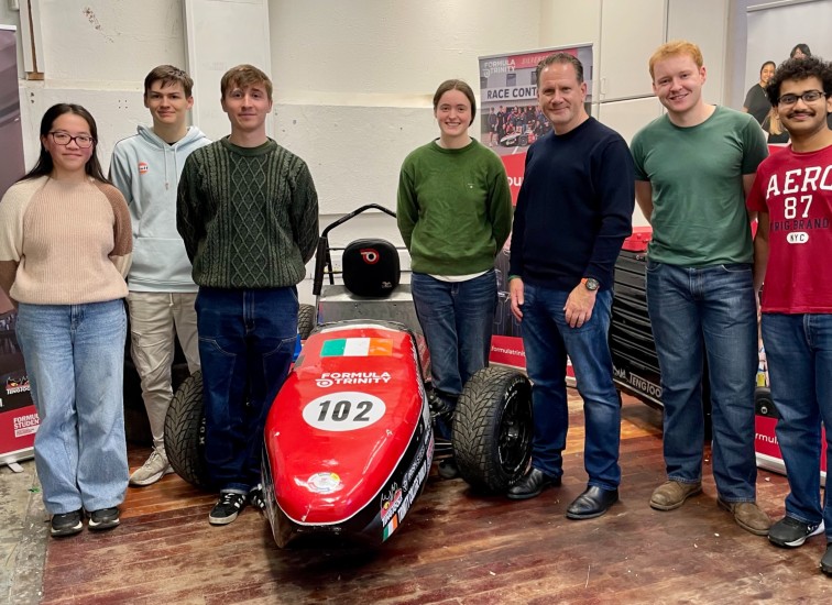 Young people with a racing car