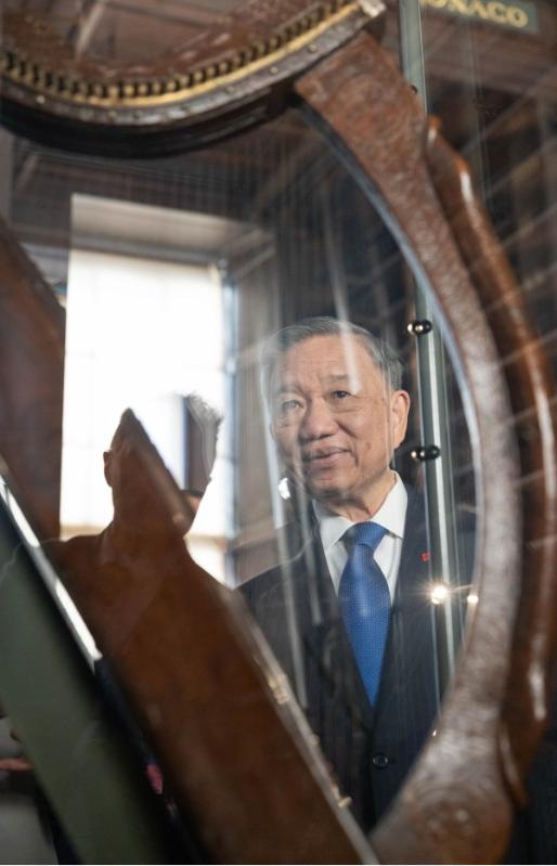Man viewed through a harp
