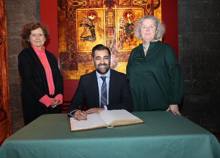 Humza Yousaf signs visitors book