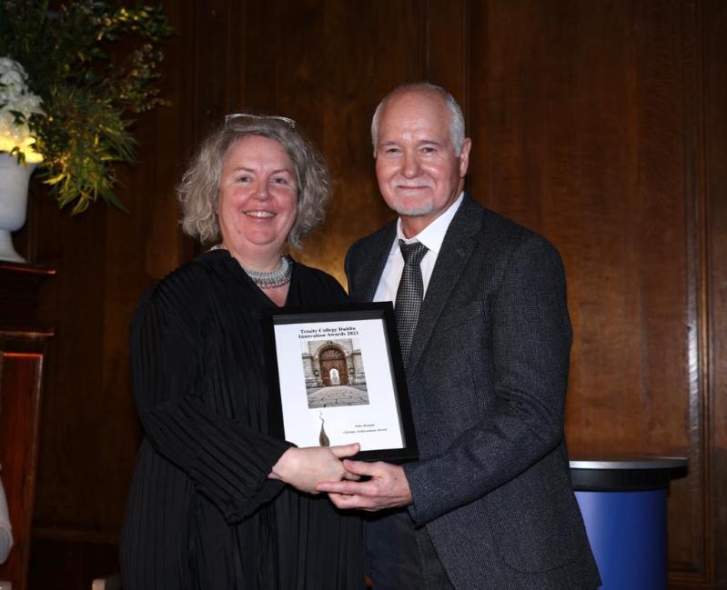 Professor John Boland receives the Lifetime Achievement Award from Dr Linda Doyle