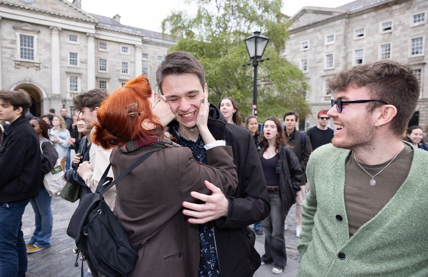 Scholar is kissed on Front Square