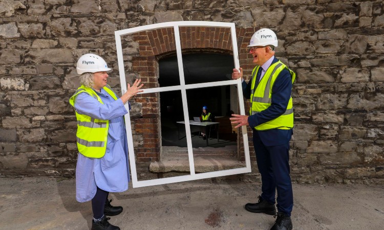 Provost Linda Doyle and Enterprise Ireland's Dr Tom Kelly hold a window frame