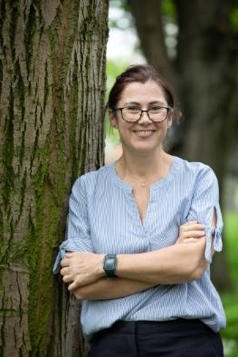 Prof Jane Stout standing beside a tree