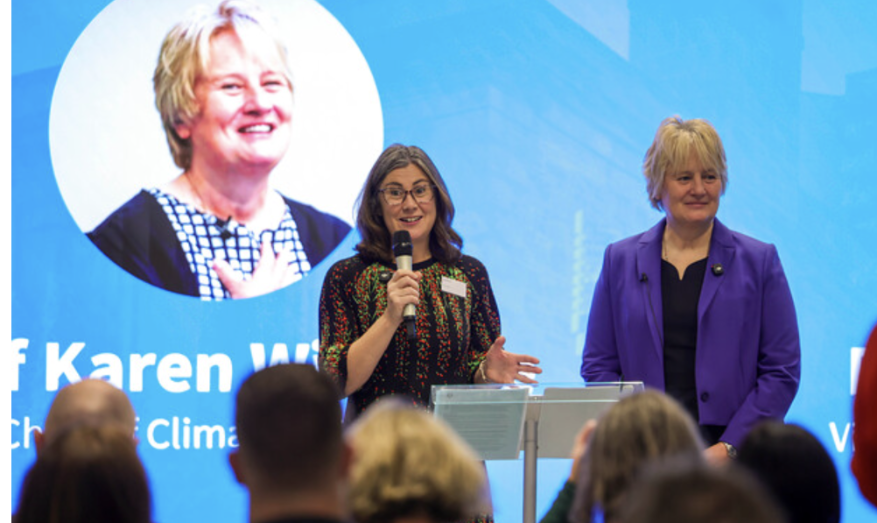 Two women address an audience