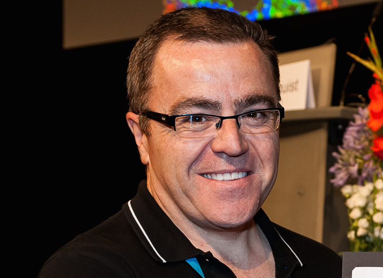 Professor Seamus Martin, smiling, wearing a black top