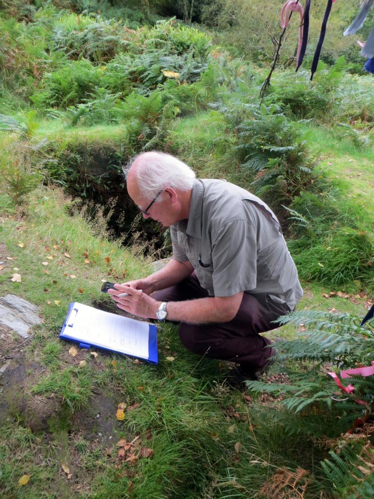 Bruce Misstear sampling water and recording notes near St Kevin's Well.