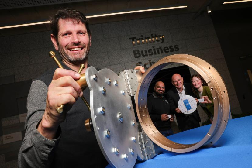 Picture of sculptor Shane Holland holding the time capsule with Punit Sobti, Laurent Muzellec and Rachel Kelly