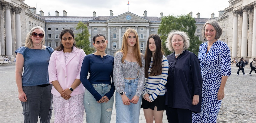 A group of women stand in Trinity College Dublin's Front Square on a summer's day