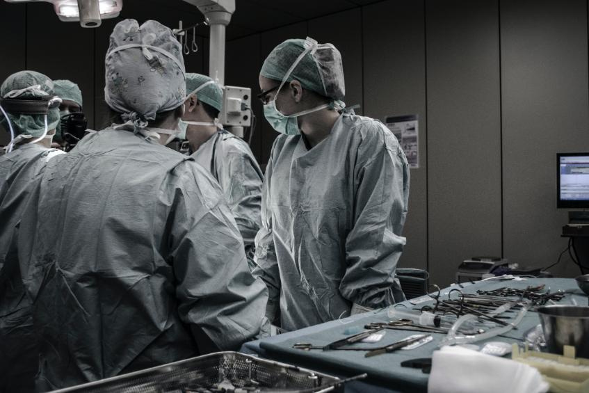 Surgeons working on a patient.